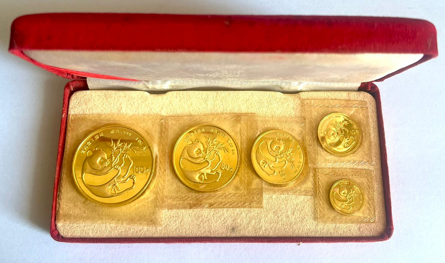 1984 China Panda 5-Coin Set (1 oz, 1/2 oz, 1/4 oz, 1/10 oz, 1/20 oz for a total of 1.90 oz) Gold Coins in Mint-Sealed Packaging (note: some coins contain toning)