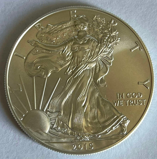 Random Year American Silver Eagle 1 oz Silver Coin in Capsule (note: contains contact marks, milk spots, and toning)