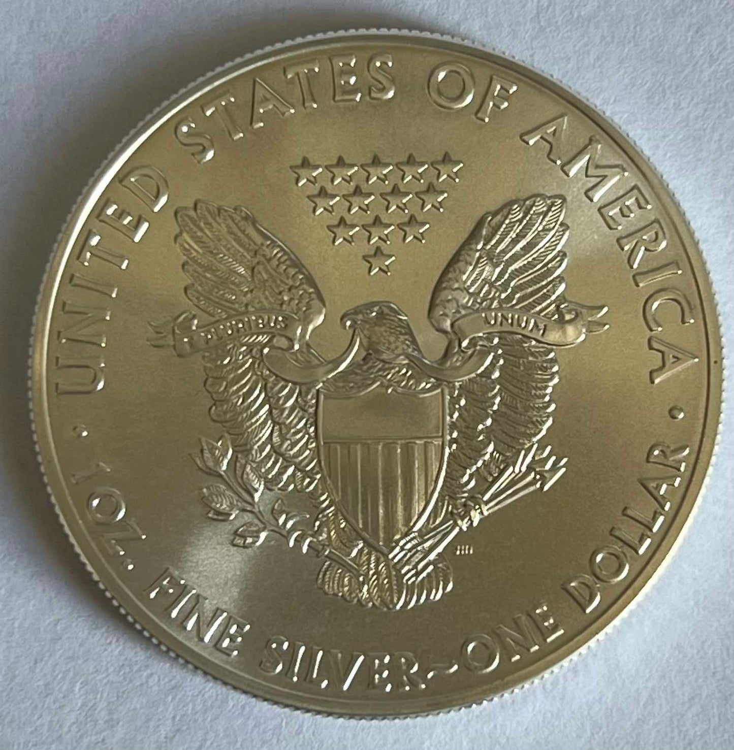 Random Year American Silver Eagle 1 oz Silver Coin in Capsule (note: contains contact marks, milk spots, and toning)