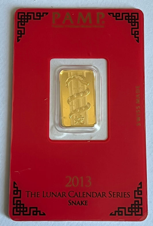 PAMP Snake 5g Gold Bar in Assay (note: backing is taped with adhesive)